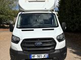 a white van that is parked on the side of the road