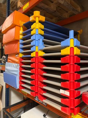 a large rack with many different colored bins on it