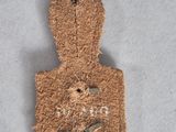 an old brown piece of cloth with the word ' o ' written on it