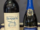 three bottles of wine sitting on a table next to a box of wine