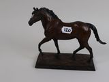 figurine of a horse with a number on it ' s chest