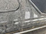 a close up of a car door handle with a sticker on it