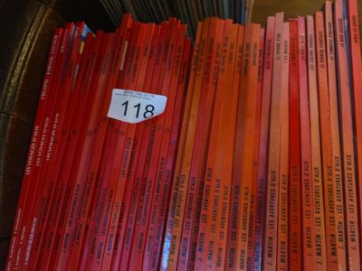 a lot of books that are sitting on a table