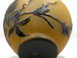 an image of a vase with a bird design on it