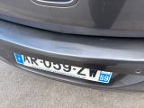 a close up of a black car with a license plate on it