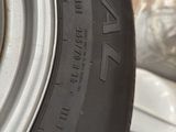 the tire of a car that is sitting on a pile of boxes