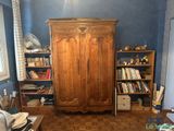 an image of a living room with bookshelves and a bookcase