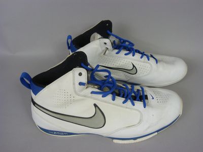 pair of white and blue sneakers with blue laces on them
