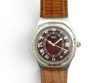 une image d'une montre-bracelet avec des chiffres romains sur le cadran