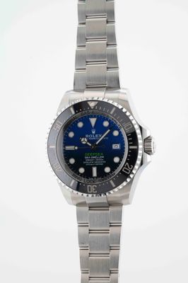 rolex submarine watch with blue dial and black bezel
