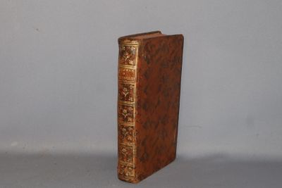 a brown book that is sitting on a table