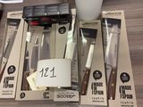 a lot of kitchen knives that are on the table