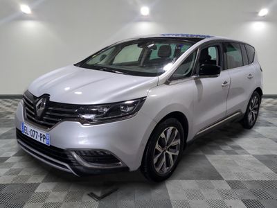 the white van is parked in a large room with a checkered floor