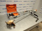 a tool that is sitting on a table next to a tool case