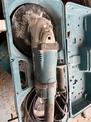 a drill in the case with a cord attached to it