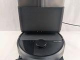 the robot is sitting on top of the table with its lid open