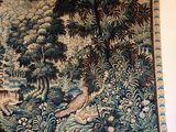 a tapestry hanging on the wall of a room