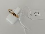a close up of a tag with a ring attached to it