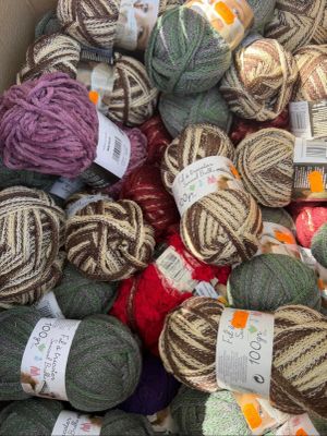 many balls of yarn in a box together