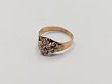 an image of a gold ring with a stone in the center