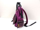 purple backpack with multi - colored dots and black straps