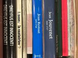 a box full of books that are sitting on top of each other