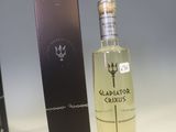 a bottle of liquor sitting next to a box on a counter