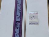 a picture of a book with a purple ribbon on it