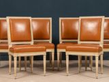 set of four chairs with leather upholstered backrests