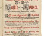 un vieux livre sur lequel figurent des inscriptions en noir et rouge