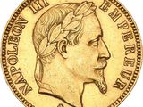 a close up of a gold coin with a man ' s face on it