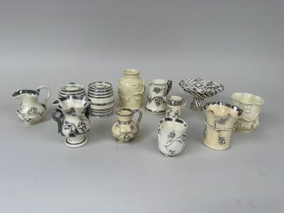 a lot of vases that are sitting on a table