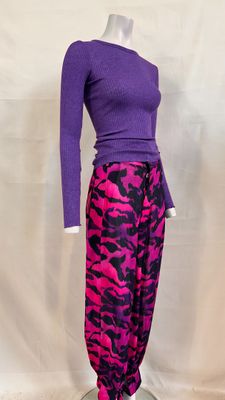 a mannequin wearing a purple top and purple pants