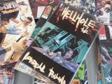 a lot of comic books on the table together
