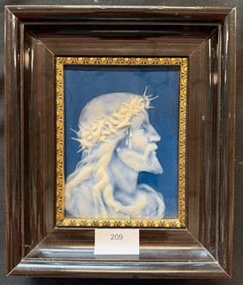 portrait of a woman with a crown of thorns on her head in a wooden frame