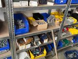 many different types of tools on the shelves in the garage