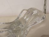 a clear glass bowl sitting on a table