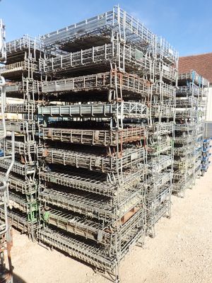 a large pile of lobster cages stacked on top of each other