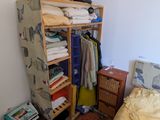 a bedroom with a bed and a closet in it