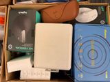 a box full of electronic items that are sitting on the floor