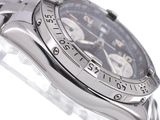 a close up of a watch on a white surface