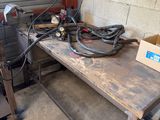 a workbench with a lot of tools on it