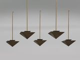 four hanging candles in a row on a gray background