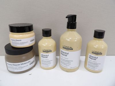 several different types of hair products are sitting on a table