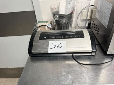 a blender sitting on top of a counter next to a blender