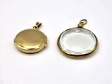 a close up of two gold lockes on a white surface