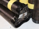a close up of a bunch of black and yellow cylinders