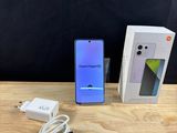 an image of a box and charger on a table next to a phone