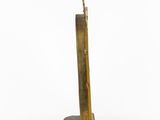 an image of a brass sculpture on a white surface with a white background
