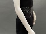 an image of a mannequin wearing a black dress and hat
